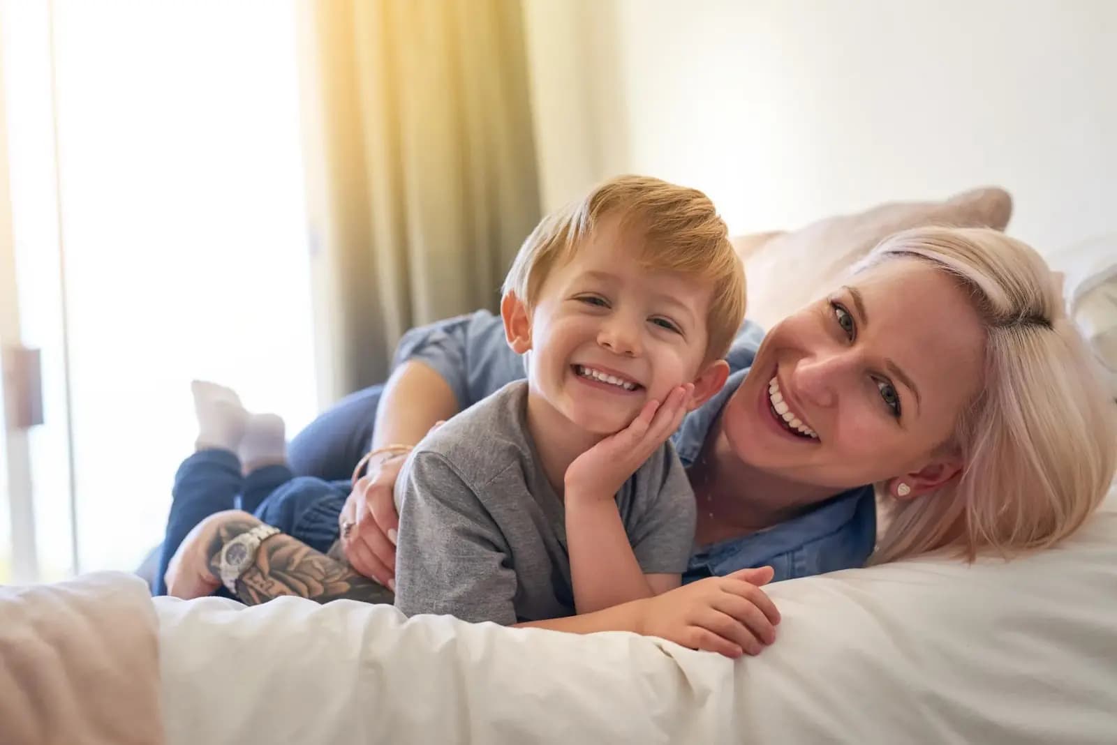 A smiling mother and her young son